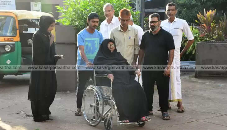 Voters queue up at a polling booth during the second phase of Kerala local body elections.