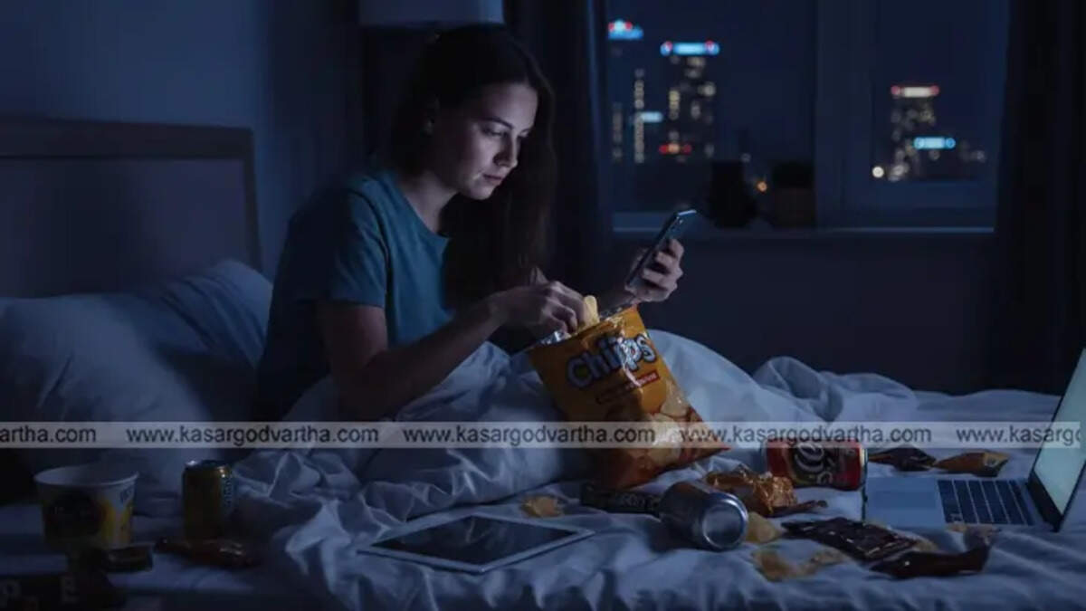  Person using phone in bed with junk food