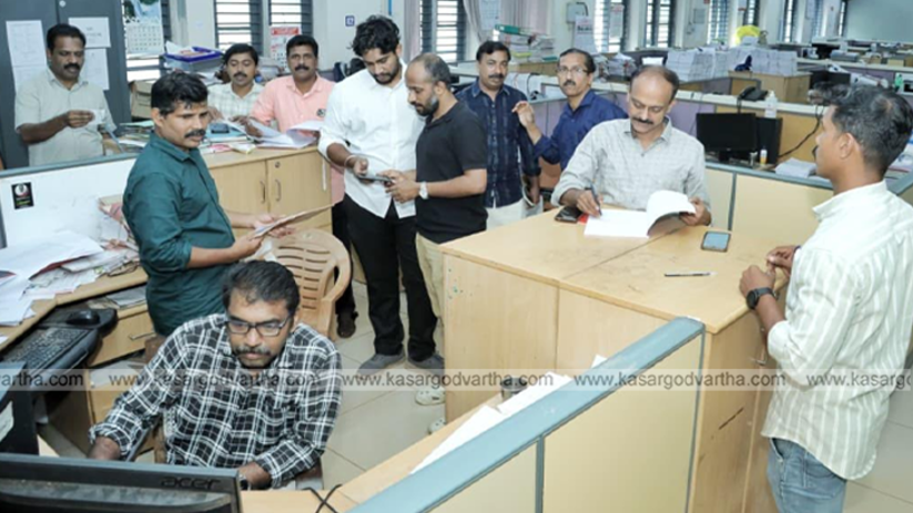 Election officials checking polling materials and voting machines.