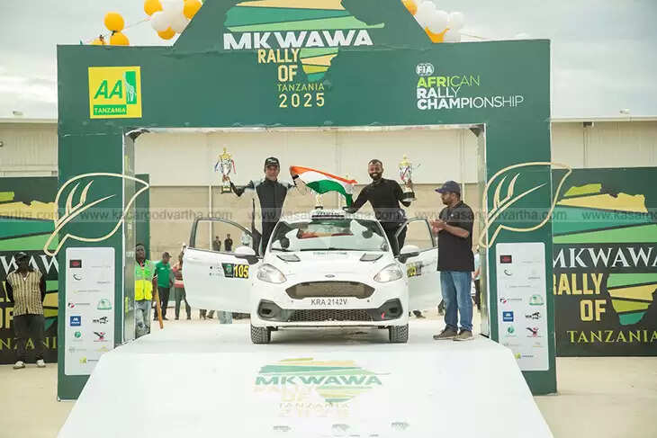 Indian motorsport legend Musa Sherif holding a trophy after his 100th international rally win.
