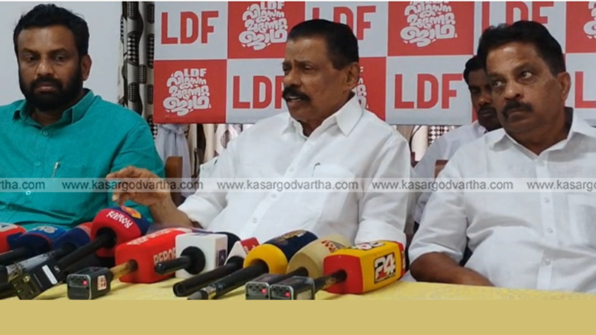 CPM State Secretary M.V. Govindan addressing a press conference in Kasaragod with microphones.