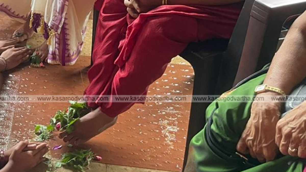 Students performing padapuja to a teacher in a school in Kasaragod.