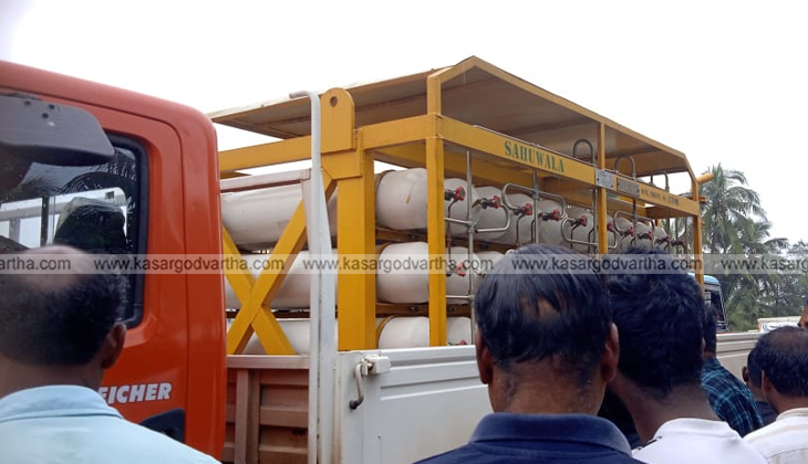 A CNG tanker truck on the side of a road after a gas leak.
