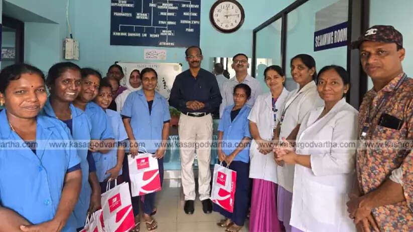 Doctor Janardhana Nayak distributing gifts to hospital staff.