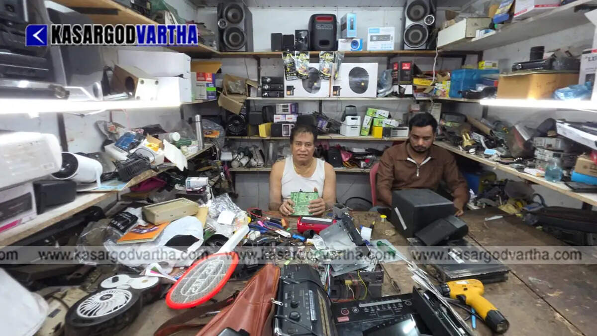 Abdul Kareem working in his electronics repair shop in Kasaragod