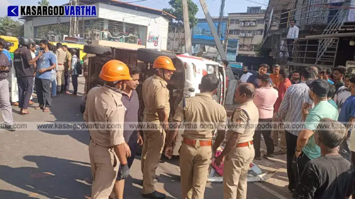 An overturned ambulance on the service road in Kasaragod Ashwini Nagar after a collision.