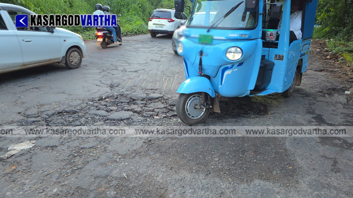Representational image of a damaged road with a crater in Kasaragod