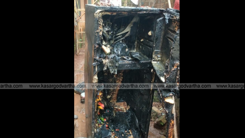 Burnt refrigerator due to short circuit fire in Mogral