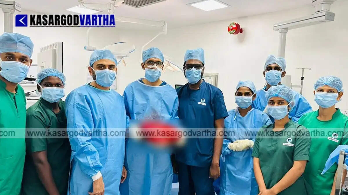 Medical team performing the surgery at Aster MIMS