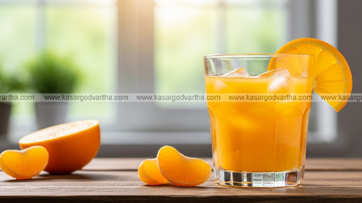 A glass of orange juice with fresh oranges, symbolizing heart health benefits.