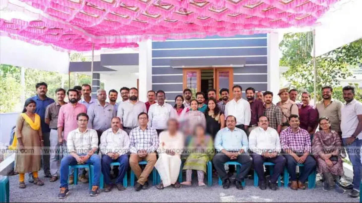   University team and Bindu in front of her new home, Kerala Central University.