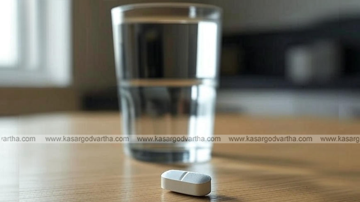  Person taking a pill with a full glass of water