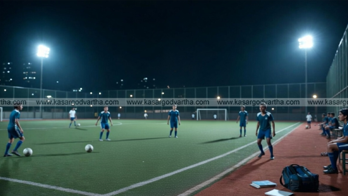 Students playing football on a turf ground at night.