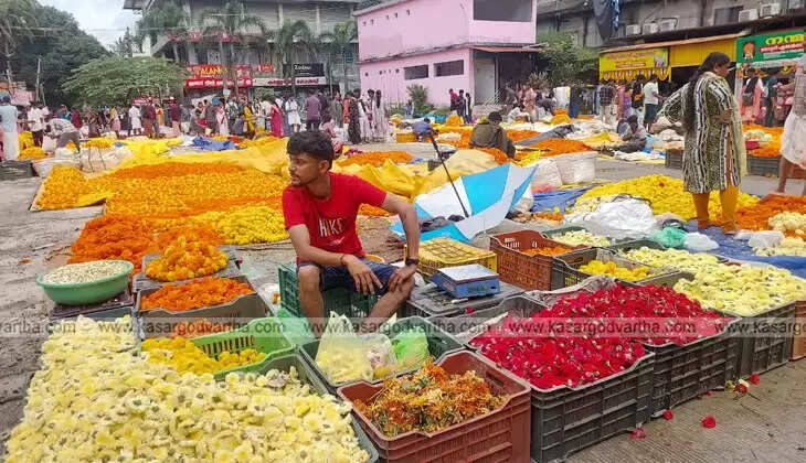 A group of flower vendors selling flowers at the Kanjangad bus stand.