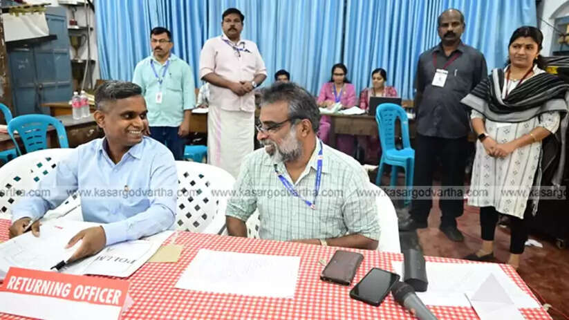 Election counting officials working on ballot boxes
