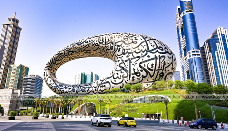 Crowd celebrating UAE National Day with flags and fireworks.