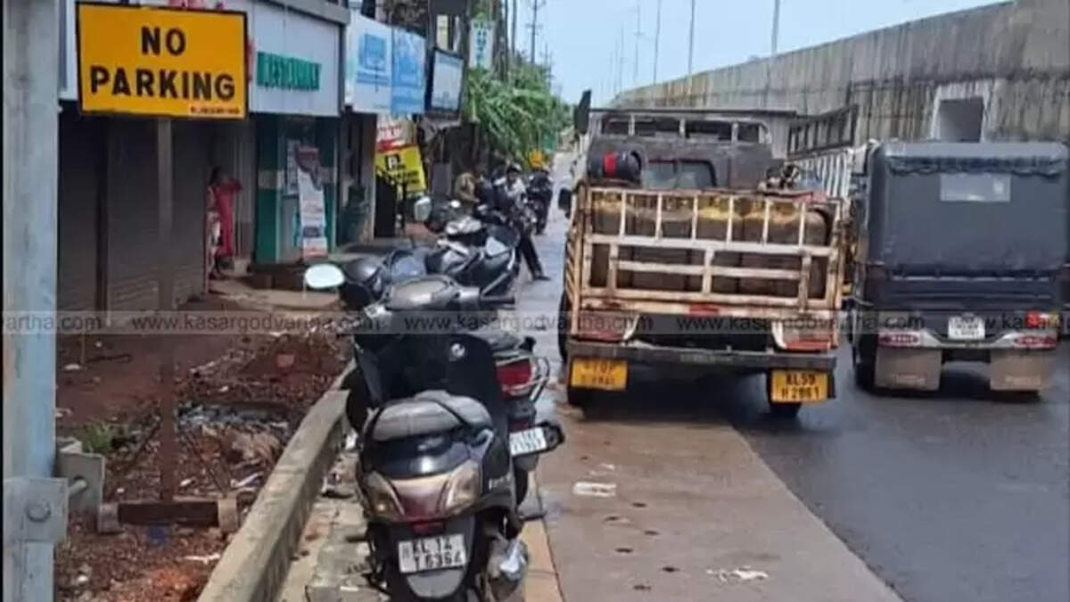 Illegally parked vehicles causing traffic congestion on Kumbala two-way service road.
