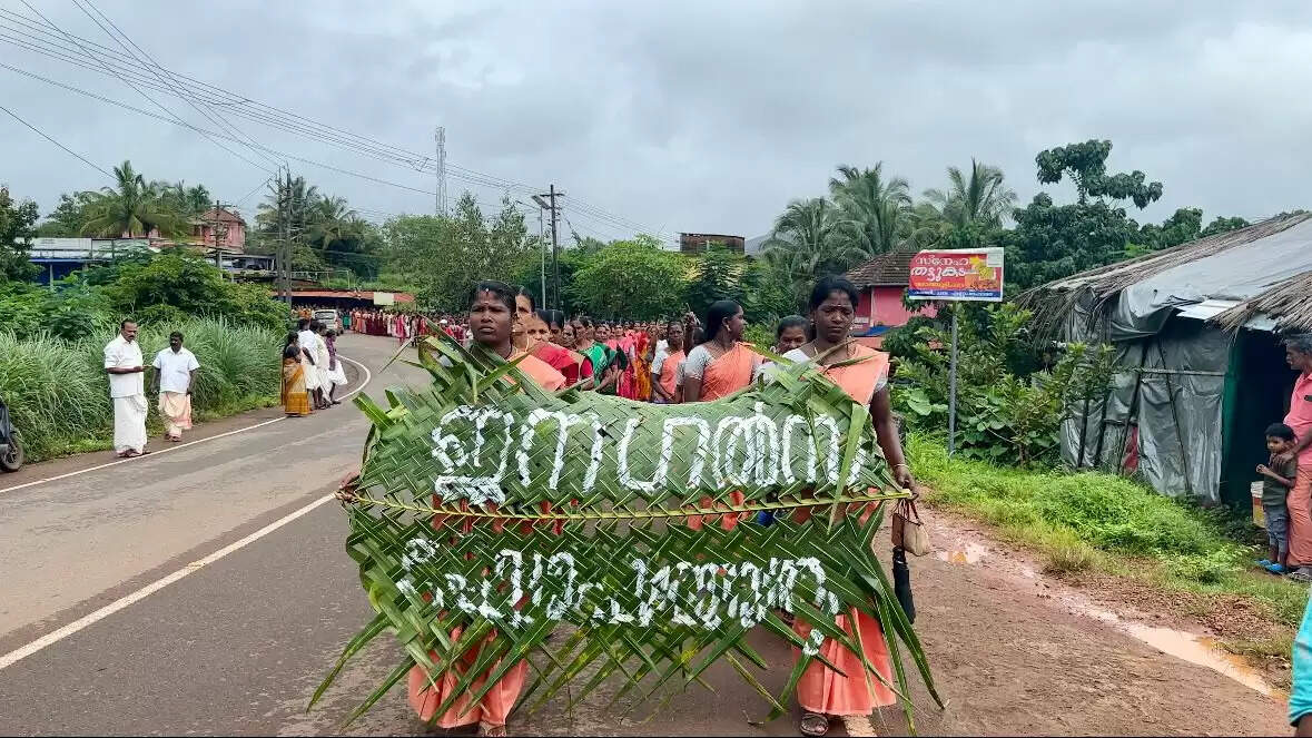 Kudumbashree procession with eco-friendly coconut palm leaf banners.