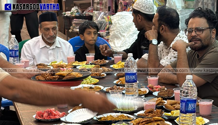 Travelers breaking their fast at an Iftar tent set up along the National Highway in Kasaragod
