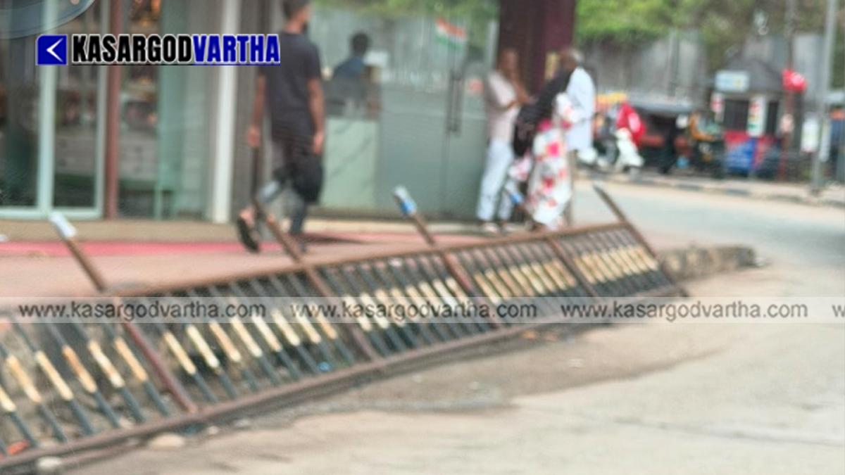 Conceptual image of a collapsed and rusted iron handrail on a city pedestrian path.