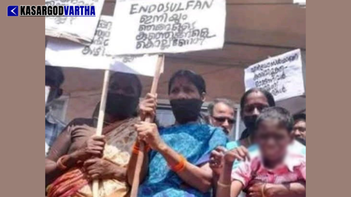 Protesters holding placards demanding justice for Endosulfan victims in Kasaragod district.