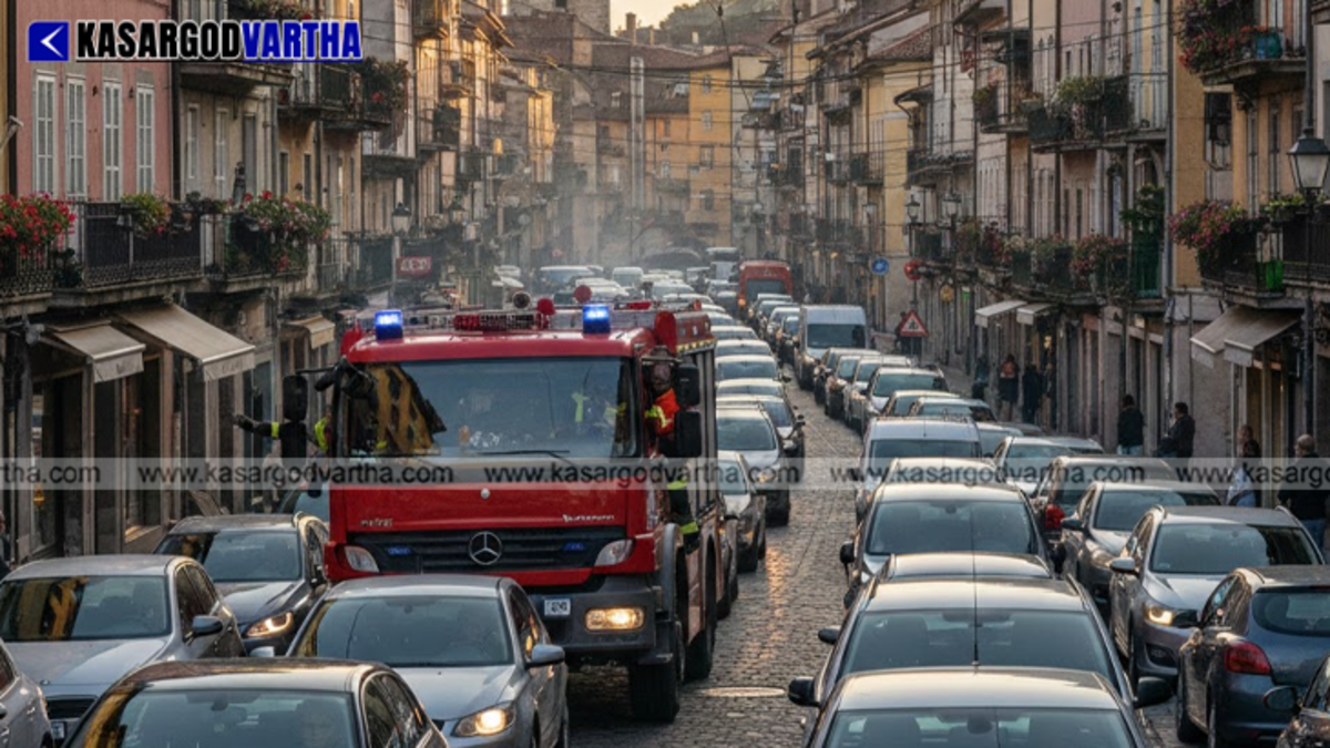 A fire engine stuck in traffic on a narrow road.