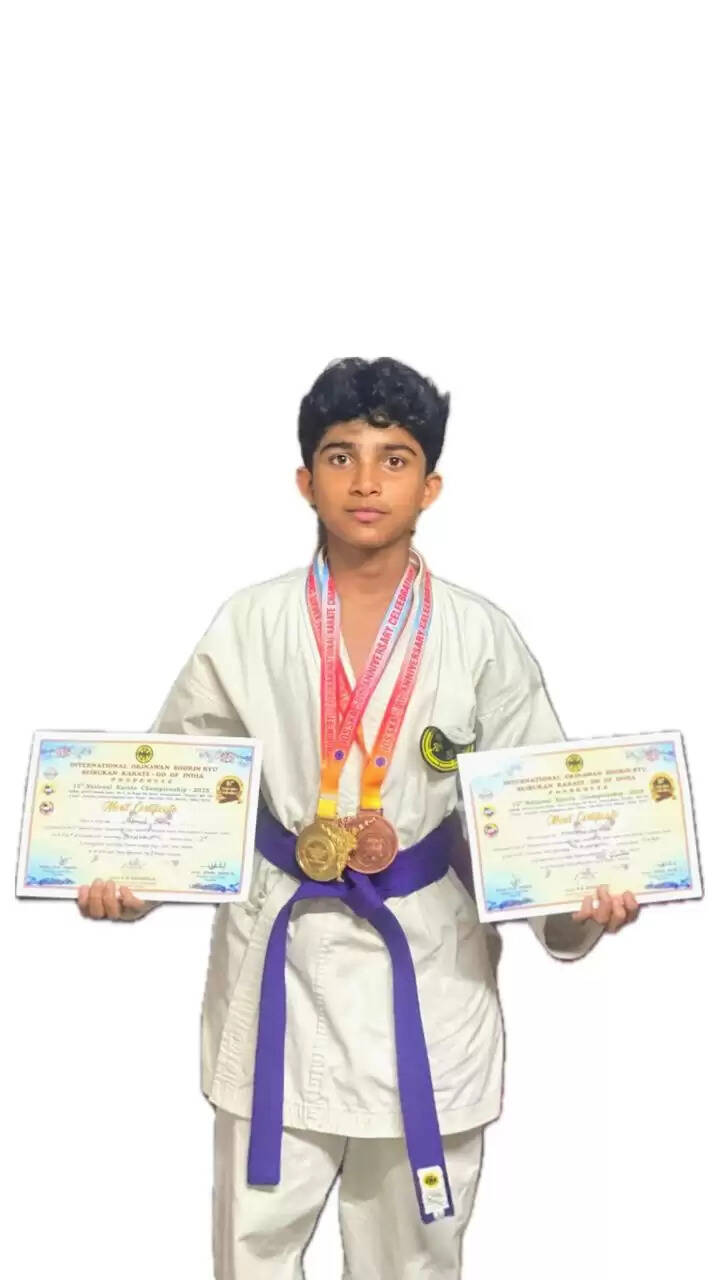 Shafeeq Hamsa with two medals and his coach Dominic Joseph.