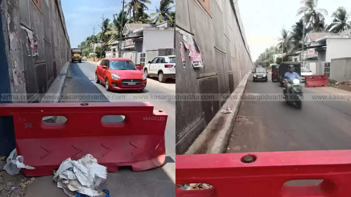 A barricade installed on the service road in Mogral Town after the removal of a speed hump.