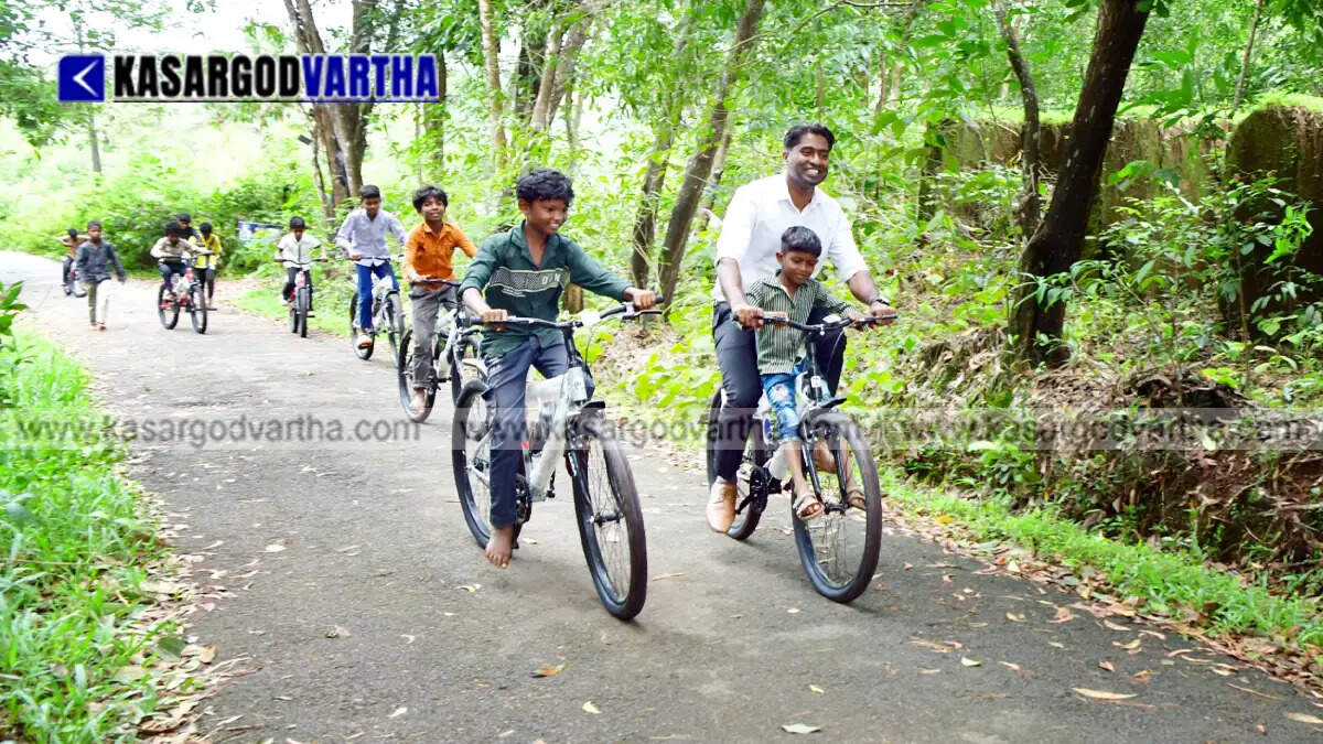 Representational image of Kasaragod Collector Arjun Pandian gifting bicycles to children