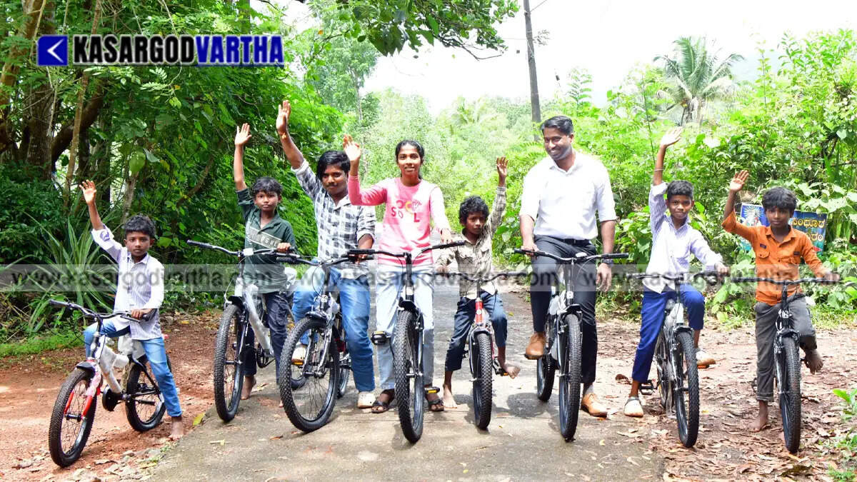 Representational image of Kasaragod Collector Arjun Pandian gifting bicycles to children