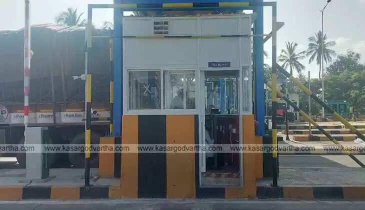 Fully constructed Arikkady Toll Gate with computer systems and passing sensors.