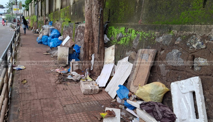 Garbage left behind by street vendors on a footpath in Kasaragod.