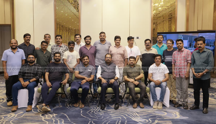 An image of the Vizhinjam International Seaport with cargo ships and cranes.