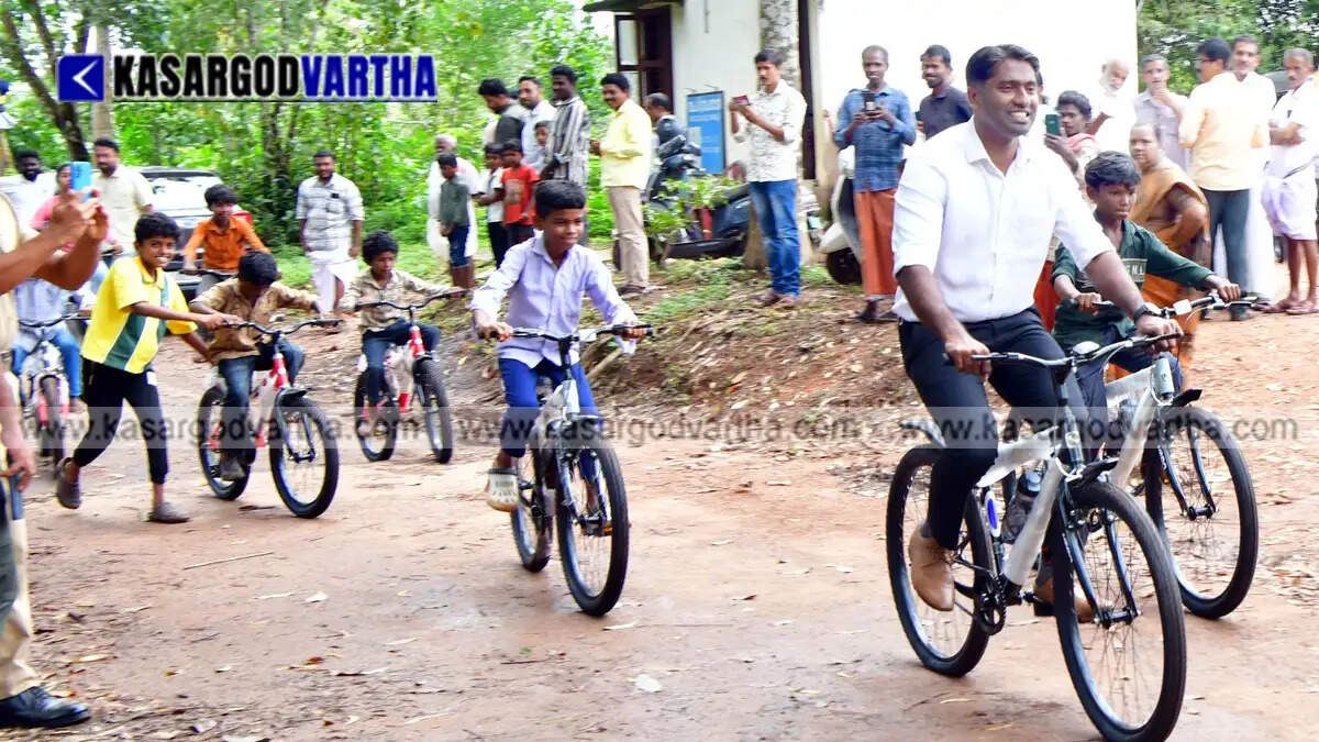 Representational image of Kasaragod Collector Arjun Pandian gifting bicycles to children