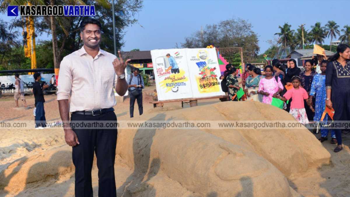 Massive sand sculpture of a voting finger at Pallikkara Beach Kasaragod.