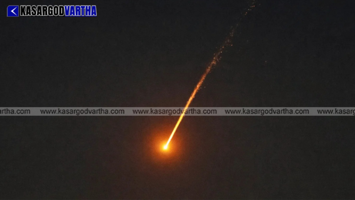 Interception of missiles lighting up the night sky over Dubai skyscrapers.