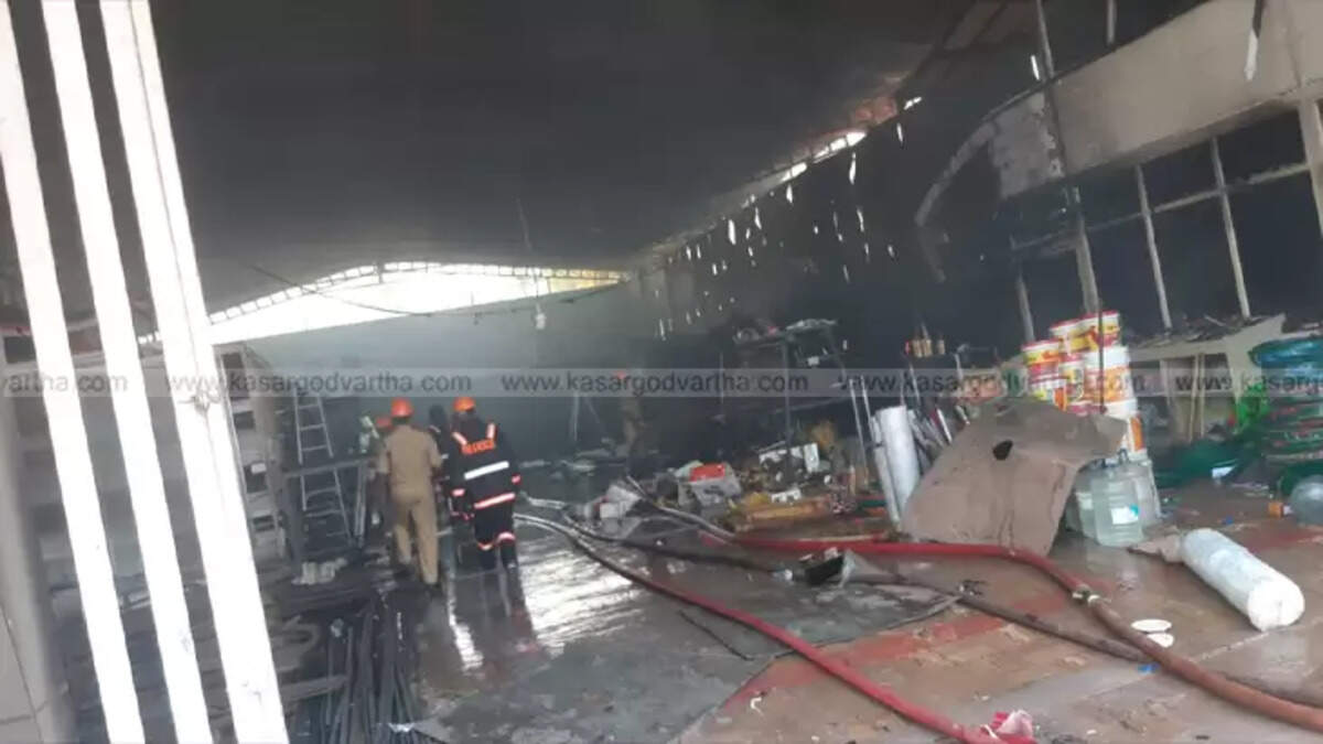 Smoke billowing out of a damaged hardware store in Kasaragod.