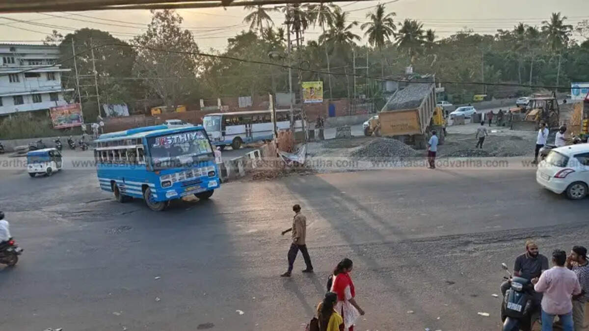  Workers constructing temporary bus exit at Kumbala traffic junction due to highway construction.