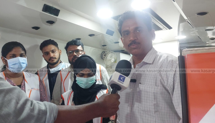 A picture of the Aster MIMS mobile medical van parked in a rural area for a health camp.