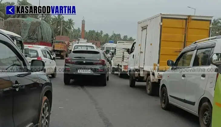 Severe waterlogging and mud at Nileshwaram Market Junction spark protests against construction company over incomplete service roads.
