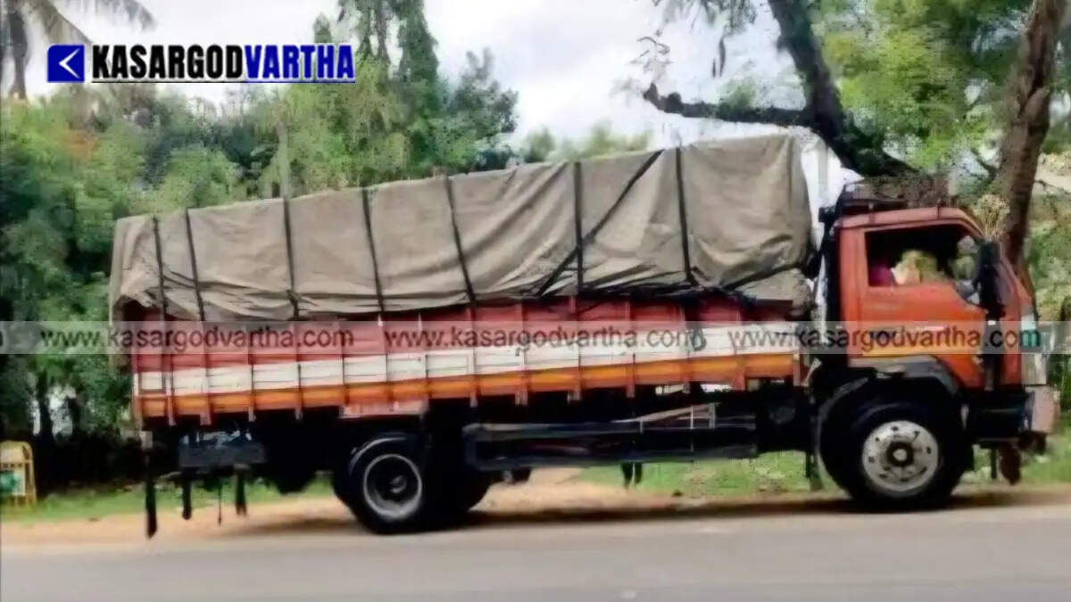 Police officials with the seized packages of ganja in Mysore.