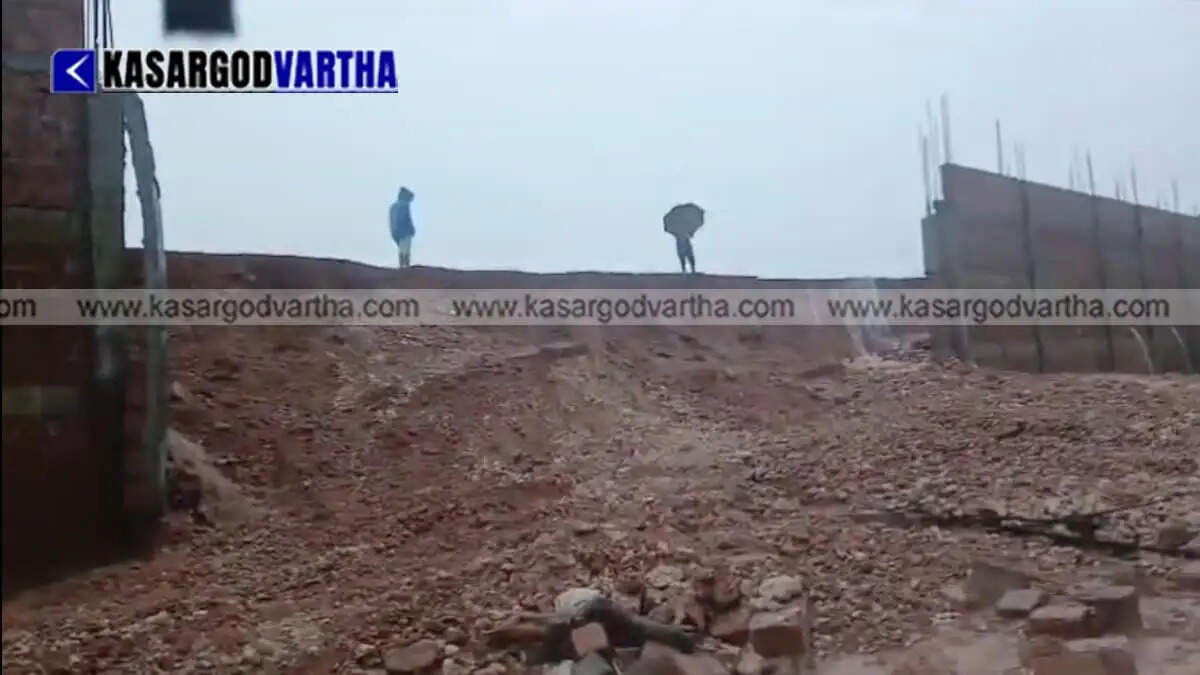 Boundary wall of Kuniya College collapses onto road in Periya due to heavy rain; traffic and power supply disrupted.