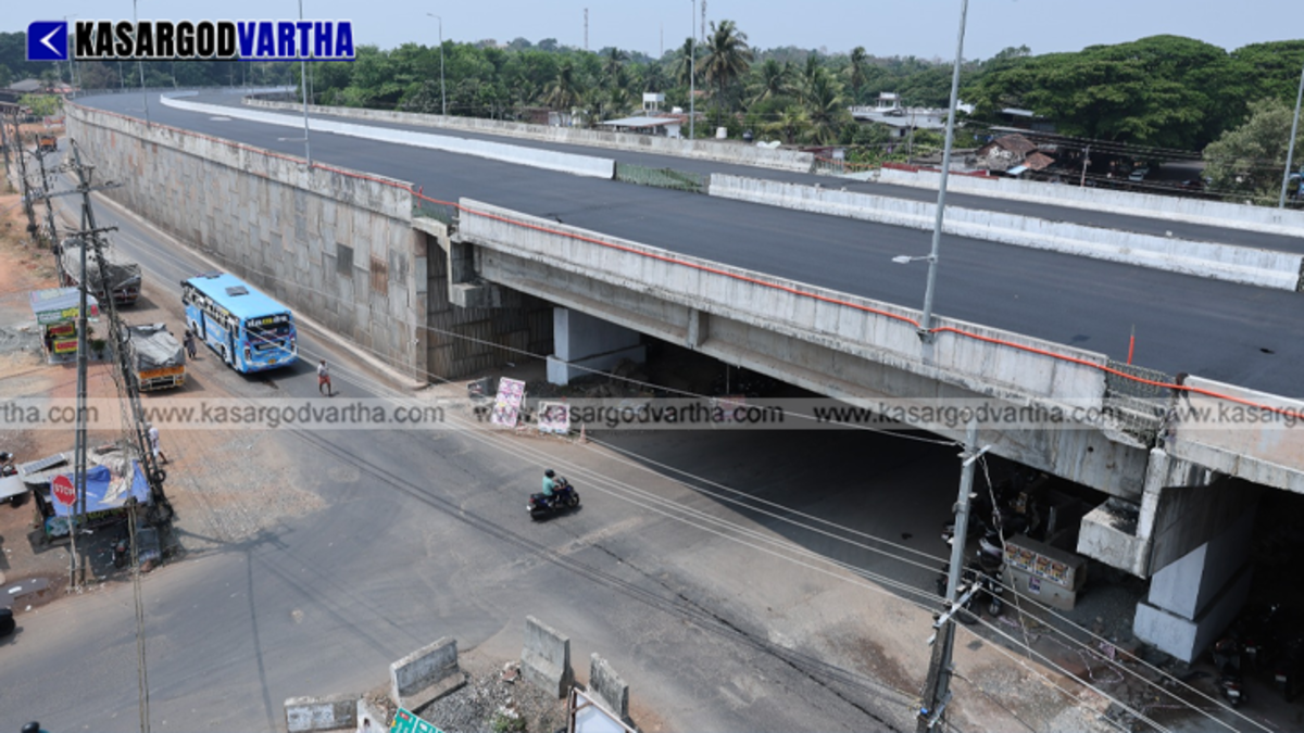 Construction machinery and workers paving the 6-lane National Highway 66 in Kasaragod