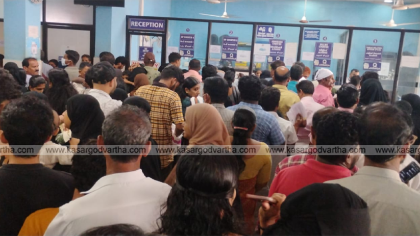 Long queue of patients waiting at the OP counter of Kasaragod General Hospital.