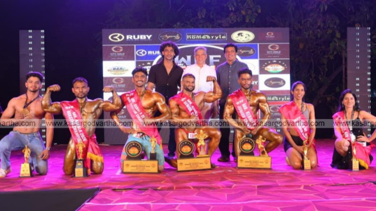 Vikas V posing with the Mr. Kerala trophy.