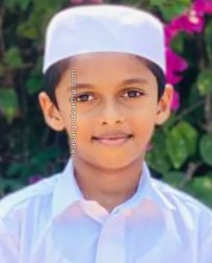 Umar Mukhtar holding the winner's trophy at the National Qira'at Competition.