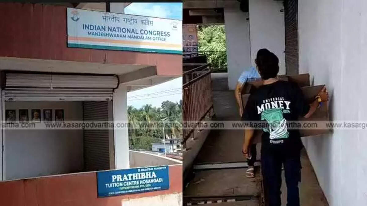 Congress workers loading office furniture into a vehicle.