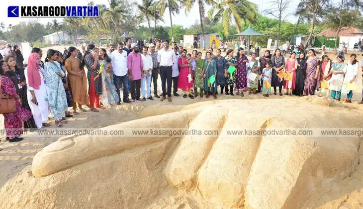 Massive sand sculpture of a voting finger at Pallikkara Beach Kasaragod.