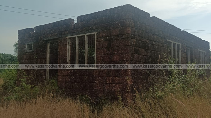 Incomplete Life Mission house overgrown with weeds