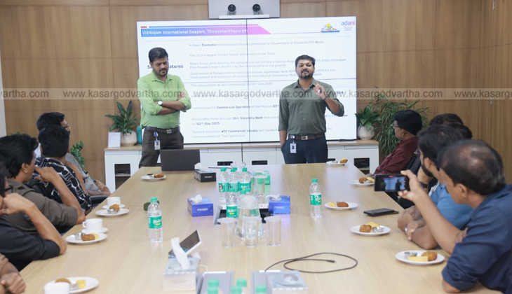 An image of the Vizhinjam International Seaport with cargo ships and cranes.
